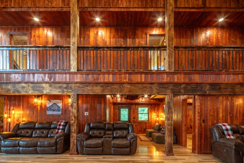 Great room with stone wood-burning fireplace — Black Eagle Lodge