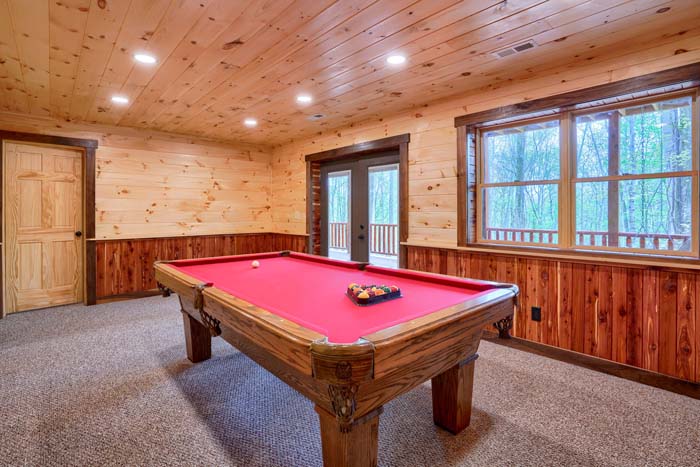 pool table with doors to deck