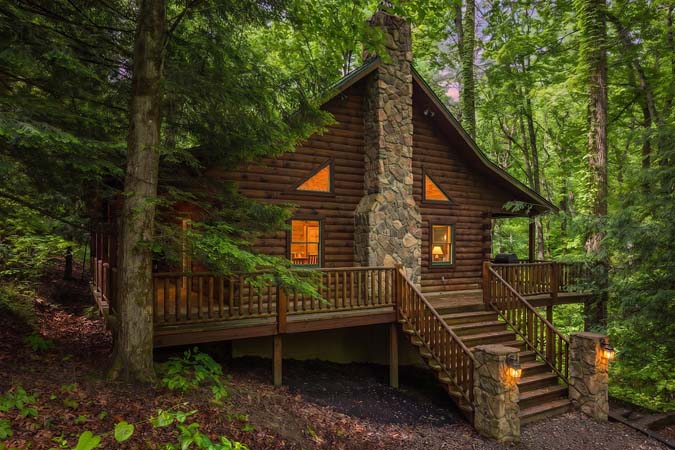 Leaning Tree Cabin exterior at dusk — Leaning Tree Cabin