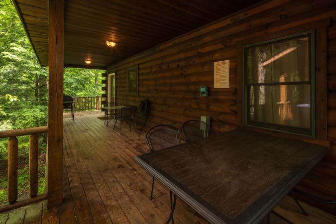 Covered porch with dining — Leaning Tree Cabin