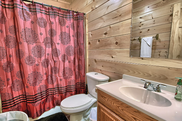 red shower curtain in bathroom