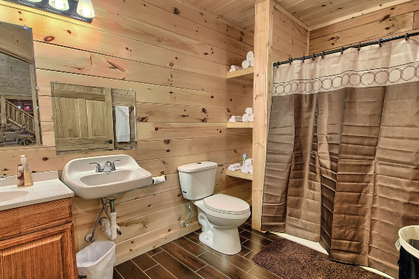 Rustic cabin bathroom with natural stone accents