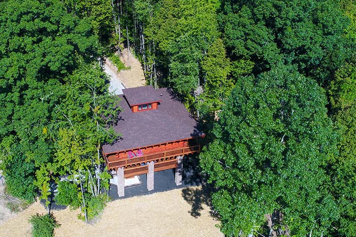 Nature-inspired log cabin tree house getaway