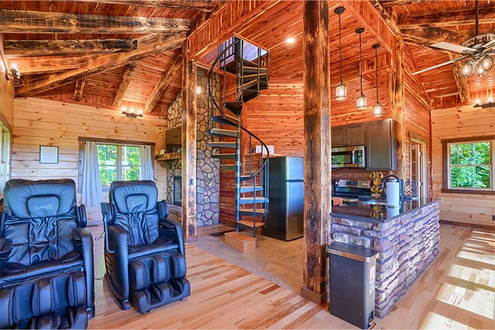 Fully equipped kitchen with stainless steel appliances and forest views