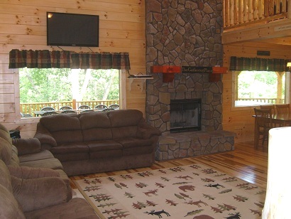 living area wtih stone fireplace