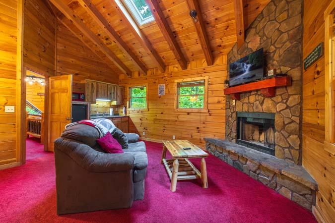 Covered porch with a swing and hot tub — Timber Ridge Lodge