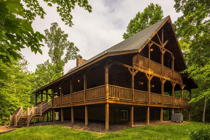 Wraparound covered deck and lodge exterior — Timber Ridge Lodge
