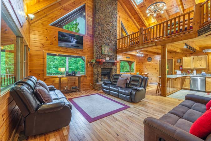 Private hot tub on the covered deck beside the grill — Timber Ridge Lodge