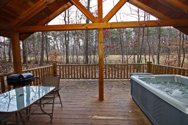 hot tub and patio set on deck